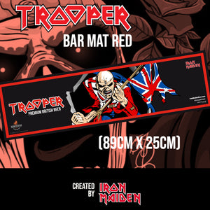 Trooper Premium British Beer red bar mat featuring Iron Maiden’s Eddie mascot with Union Jack flag, created by Robinsons Brewery. Size: 89cm x 25cm.