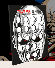 Load the picture into the gallery viewer, Front view of Iron Maiden Trooper bottlecap collector foam board, created by Robinsons Brewery, featuring Eddie mascot design and spaces for bottle caps.
